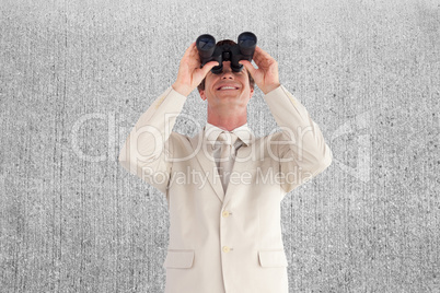 Composite image of confident businessman with binoculars