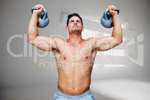 Composite image of bodybuilder holding kettlebells