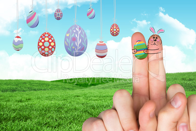 Composite image of fingers as easter bunny