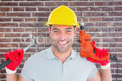 Composite image of happy repairman holding hammer and drill mach