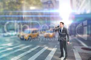 Composite image of businessman looking through binoculars