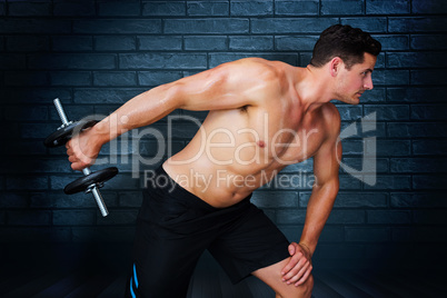 Composite image of bodybuilder lifting dumbbell