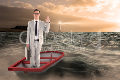 Composite image of businessman waving in boat