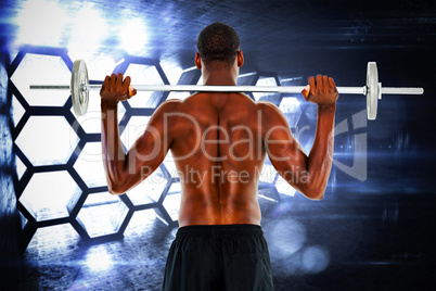 Composite image of rear view of a fit shirtless man lifting barb
