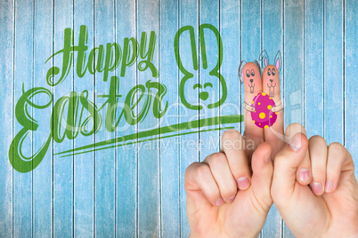 Composite image of fingers as easter bunny