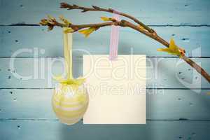 Composite image of hanging easter egg and card