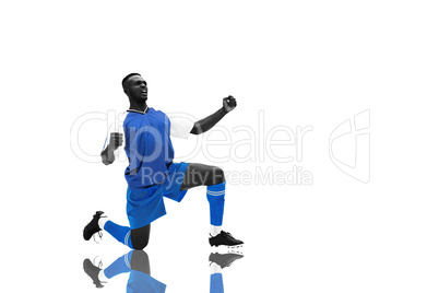 Composite image of cheering football player