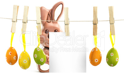 Composite image of hanging easter eggs