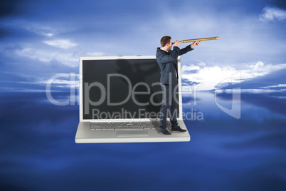 Composite image of businessman looking through telescope