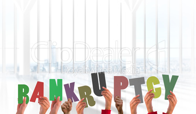 Composite image of hands holding up bankruptcy