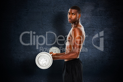 Composite image of portrait of a serious fit young man lifting b