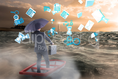 Composite image of businessman in boat with umbrella