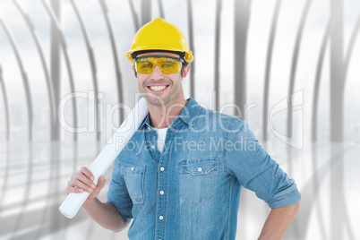 Composite image of architect holding rolled blueprint