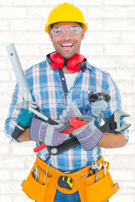 Composite image of portrait of smiling manual worker holding var