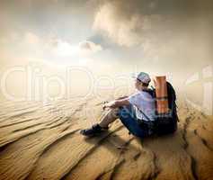 Tourist in sand desert