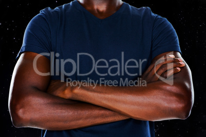 Composite image of close up mid section of man with arms crossed