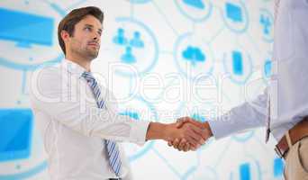 Composite image of two businessmen shaking hands in office