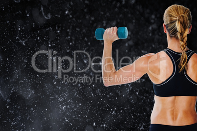 Composite image of female bodybuilder holding a blue dumbbell