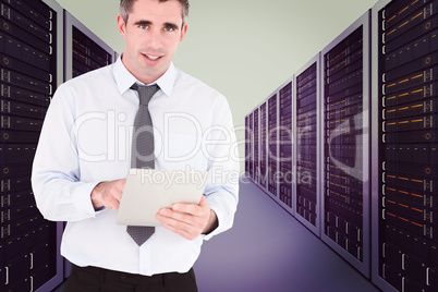 Composite image of portrait of a businessman with a tablet compu