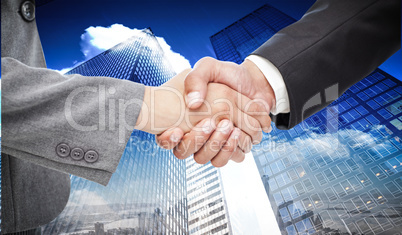 Composite image of handshake between two business people