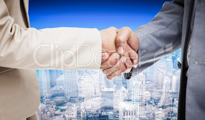 Composite image of close up of people shaking hands