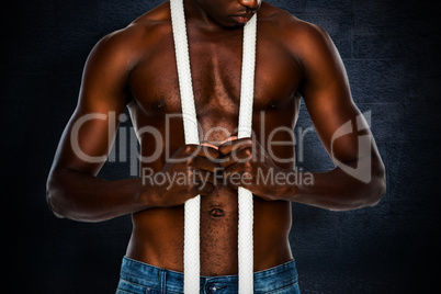 Composite image of mid section of shirtless muscular man