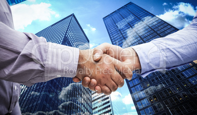 Composite image of men shaking hands