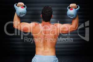 Composite image of bodybuilder holding kettlebell