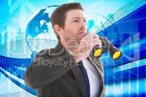 Composite image of focused handsome businessman holding binocula