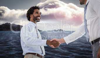 Composite image of two businessmen shaking hands in office