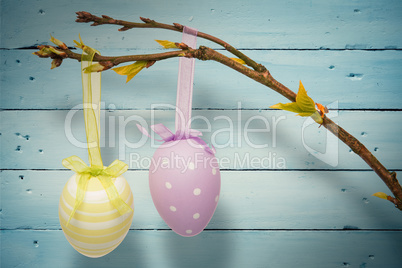 Composite image of hanging easter eggs