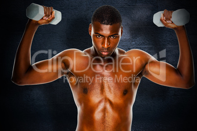Composite image of determined fit shirtless man lifting dumbbell Composite image of determined fit shirtless man lifting dumbbell