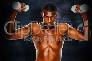 Composite image of determined fit shirtless man lifting dumbbell