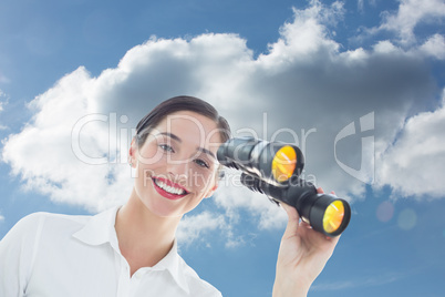 Composite image of smiling business woman with binoculars