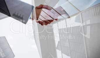 Composite image of shaking hands after business meeting