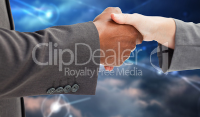 Composite image of business handshake