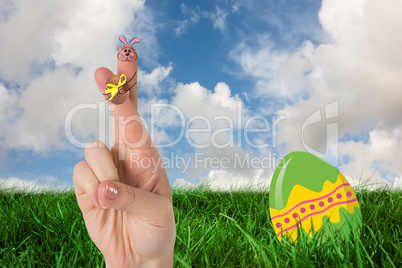 Composite image of fingers as easter bunny