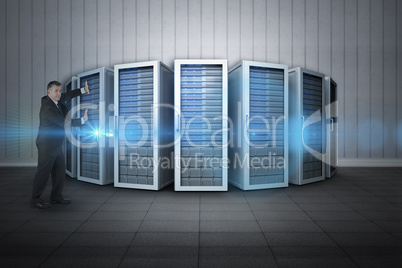 Composite image of mature businessman pushing Composite image of mature businessman pushing