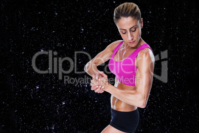 Composite image of female bodybuilder flexing in pink sports bra