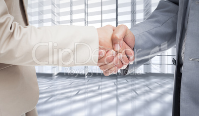 Composite image of close up of people shaking hands