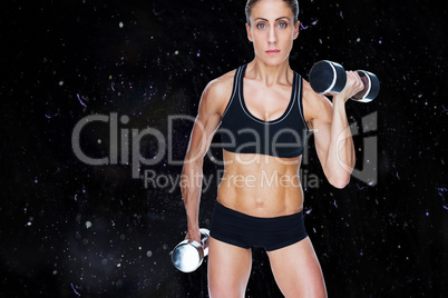 Composite image of female bodybuilder working out with large dum