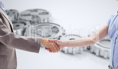 Composite image of handshake between two women