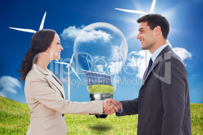 Composite image of future partners shaking hands