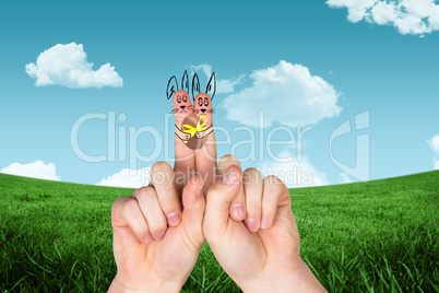 Composite image of fingers as easter bunny