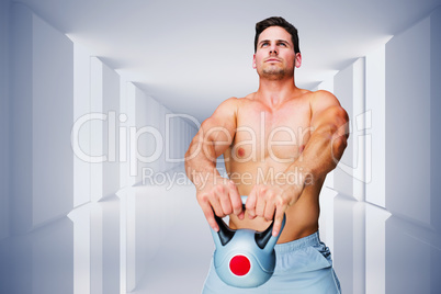 Composite image of bodybuilder holding kettlebell