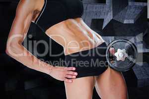 Composite image of female bodybuilder holding large black dumbbe