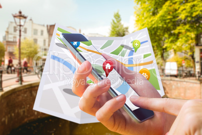 Composite image of man using map app on phone