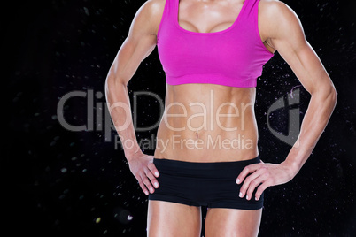 Composite image of female bodybuilder posing in pink sports bra