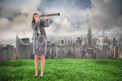 Composite image of businesswoman looking through a telescope