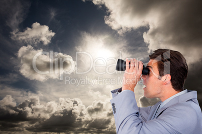 Composite image of visionary businessman looking to the future